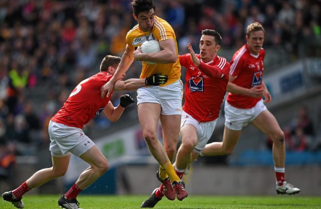 23 April 2016; Niall McKeever, Antrim, in action against Conal McKeever, left, and Derek Maguire, Louth. Allianz Football League, Division 4, Final, Louth v Antrim. Croke Park, Dublin. Picture credit: Ray McManus / SPORTSFILE