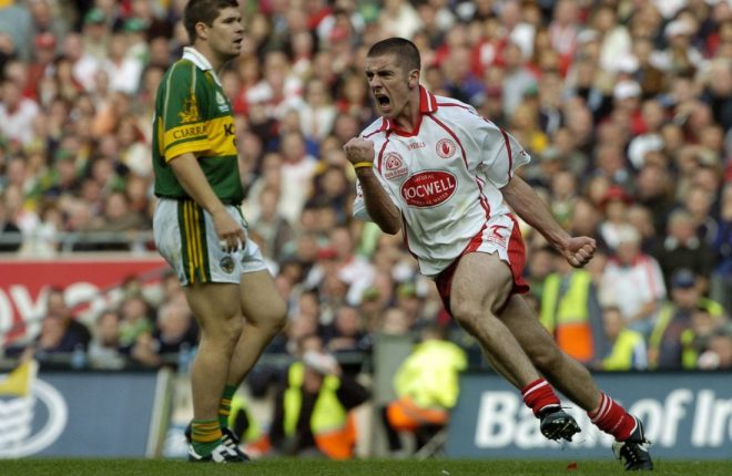 25 September 2005; Philip Jordan, Tyrone, celebrates a late point as Kerry's Eamon Fitzmaurice looks on. Bank of Ireland All-Ireland Senior Football Championship Final, Kerry v Tyrone, Croke Park, Dublin. Picture credit; Damien Eagers/ SPORTSFILE *** Local Caption *** Any photograph taken by SPORTSFILE during, or in connection with, the 2005 Bank of Ireland All-Ireland Senior Football Final which displays GAA logos or contains an image or part of an image of any GAA intellectual property, or, which contains images of a GAA player/players in their playing uniforms, may only be used for editorial and non-advertising purposes.  Use of photographs for advertising, as posters or for purchase separately is strictly prohibited unless prior written approval has been obtained from the Gaelic Athletic Association.