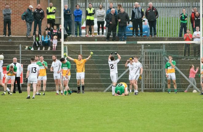 Carrickmore players are distraught while the Clonoe men celebrate